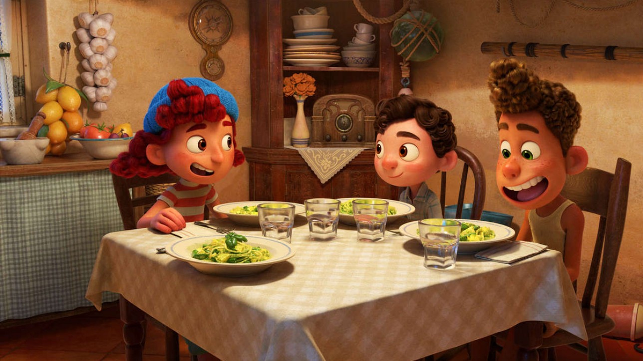 TRENETTE AL PESTO! -- Emma Berman, Jacob Tremblay and Jack Dylan Grazer provide the voices of a trio of new friends in Disney and Pixar’s “Luca.” Outgoing and charming, Giulia invites Luca and Alberto to her house where they have pasta for the first time—it’s a hit. What she doesn’t know, however, is that her new friends are actually sea monsters who just look human when they’re dry. Directed by Academy Award® nominee Enrico Casarosa (“La Luna”) and produced by Andrea Warren (“Lava,” “Cars 3”), “Luca” debuts on Disney+ on June 18, 2021. © 2021 Disney/Pixar. All Rights Reserved.