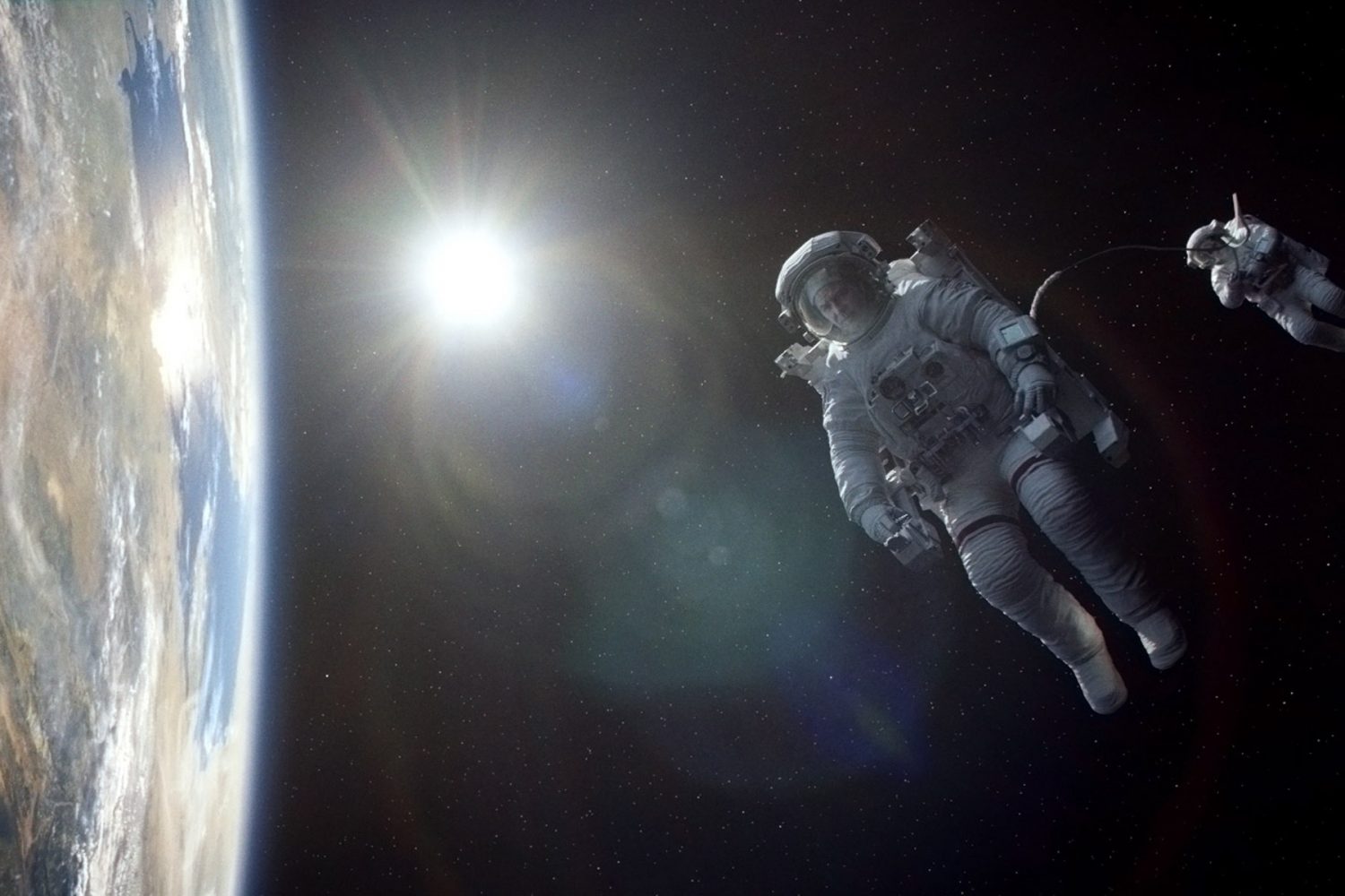 George Clooney and Sandra Bullock play astronauts marooned in space in <em>Gravity,</em> a visual marvel of a movie from director Alfonso Cuaron<em>. </em>