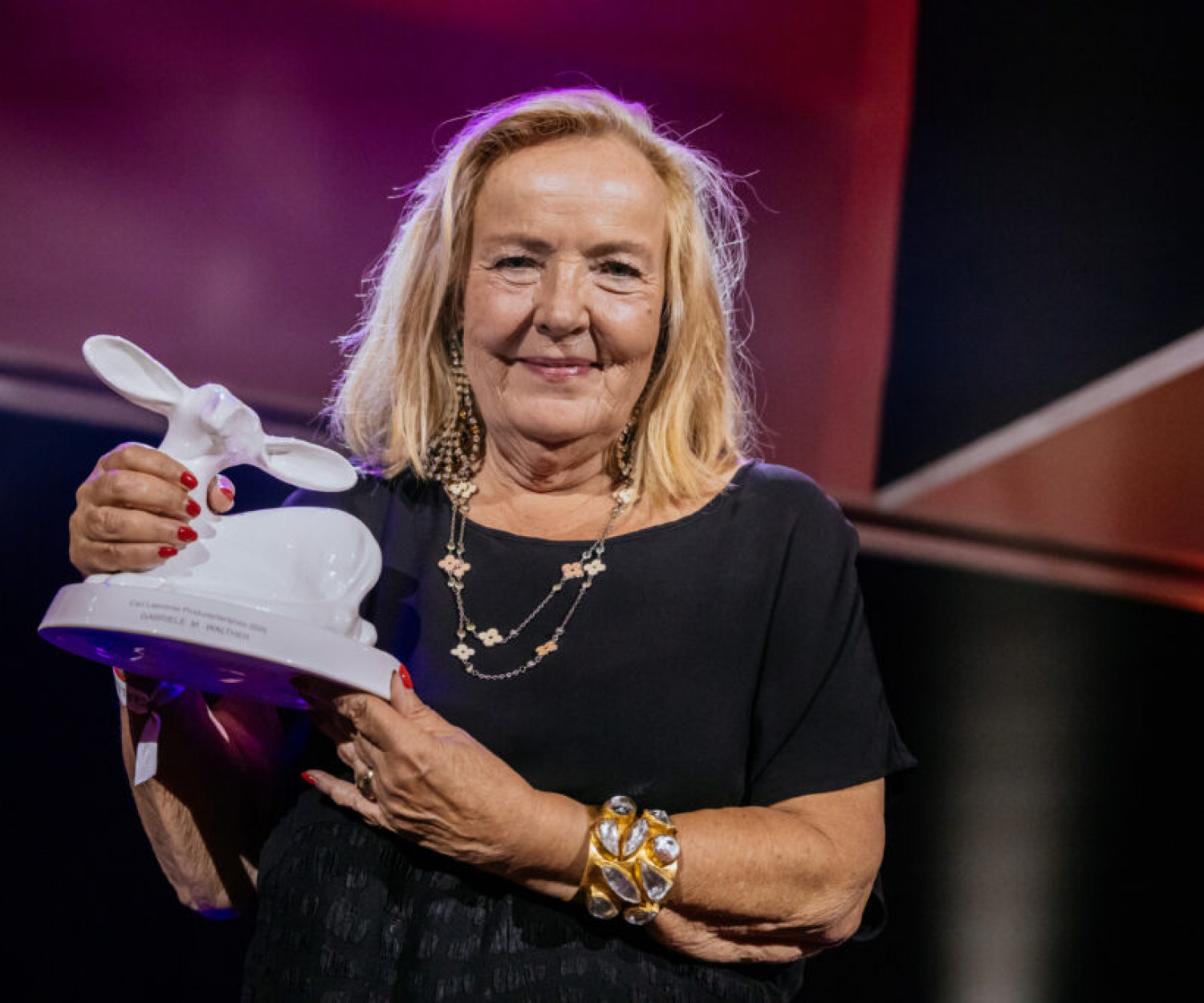 LAUPHEIM, GERMANY - SEPTEMBER 19: Gabriele M. Walther shows the trophy at the Carl Laemmle Produzentenpreis 2025 (Producer Award) at Schloss Laupheim on September 19, 2025 in Laupheim, Germany. (Photo by Thomas Niedermueller/Getty Images for Carl Laemmle UG)